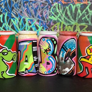 Custom graffiti artwork made on MINI empty spray cans