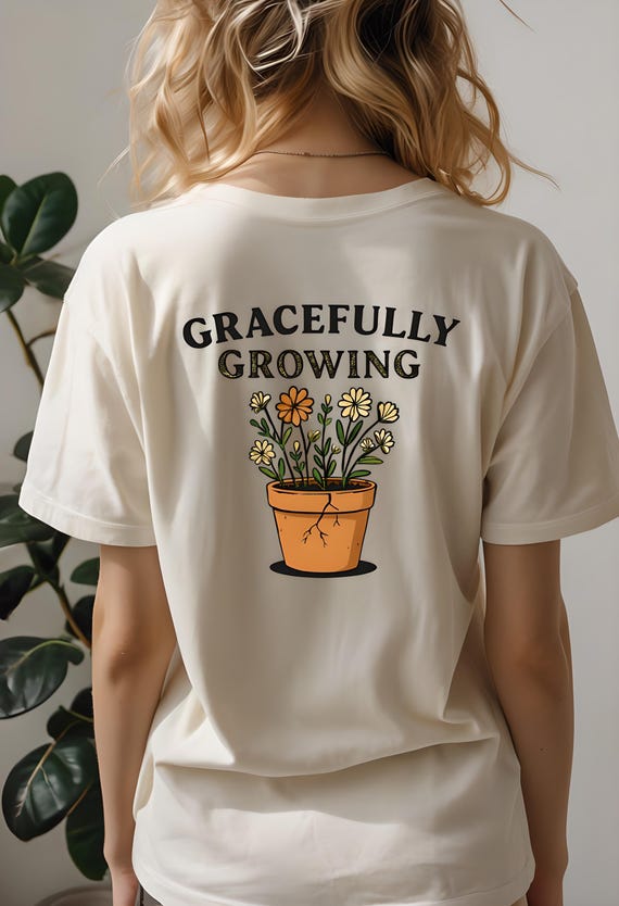 Gracefully Growing Floral T-Shirt: Cracked Pot Wildflower Design