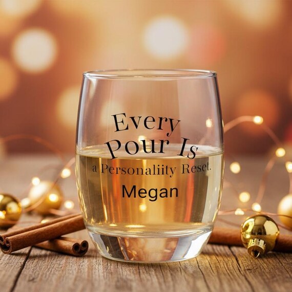 Clear 6 oz whiskey wine glass with the quote ‘Every Pour Is a Personality Reset’ and space for a personalized name underneath.”
