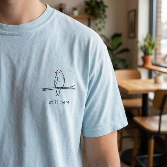 still here t-shirt  minimalist bird graphic tee  comfort colors 1717  quiet resilience shirt |
