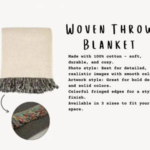 May include: A woven throw blanket with a cream-colored body and a dark gray fringed edge. The text "WOVEN THROW BLANKET" is displayed in a handwritten font. The blanket is made of 100% cotton.