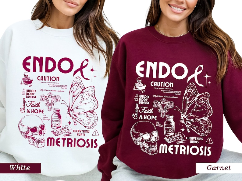 May include: Two sweatshirts, one white and one burgundy, with a graphic design featuring a butterfly, a skull, and the text "ENDOL CAUTION WHOLE BODY DISEASE Courage Faith & HOPE EVERYTHING HURTS METRIOSIS".