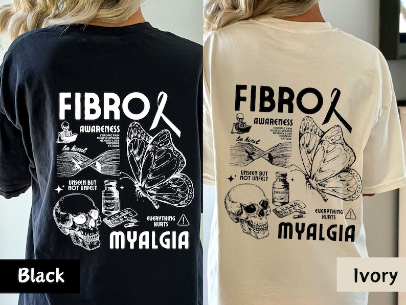 May include: Black and ivory t-shirts with a graphic design featuring a butterfly, skull, pills, and the text "FIBRO AWARENESS EVERYTHING HURTS MYALGIA".