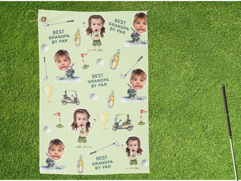 May include: A light green golf towel featuring a repeating pattern of a child's face, golf equipment, and the text "BEST GRANDPA BY PAR". The design includes golf clubs, golf balls, golf carts, and trophies.