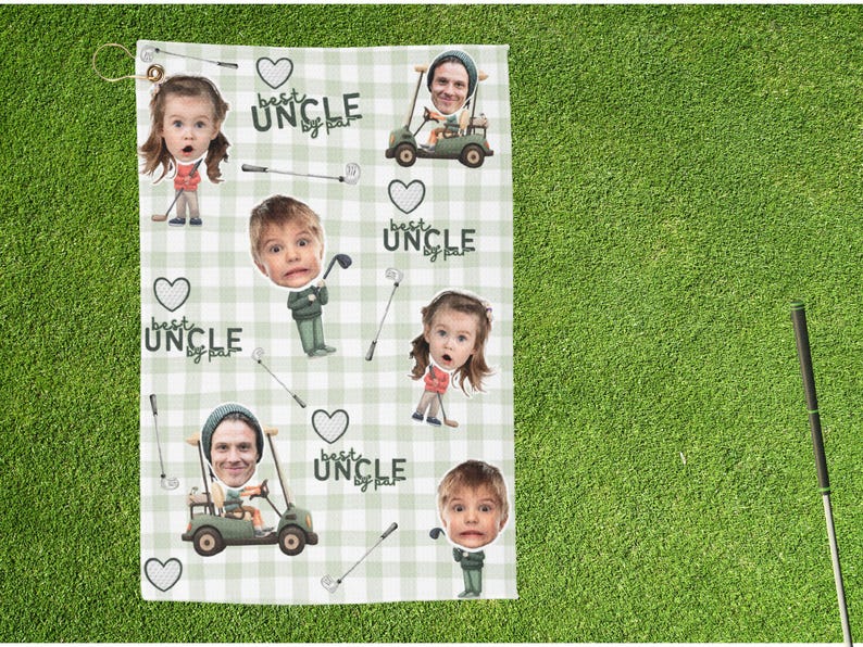 May include: Golf towel with a green and white checkered pattern. The towel features cartoon images of people and golf clubs, with the text "best uncle by par" and heart shapes. A gold grommet is at the top.
