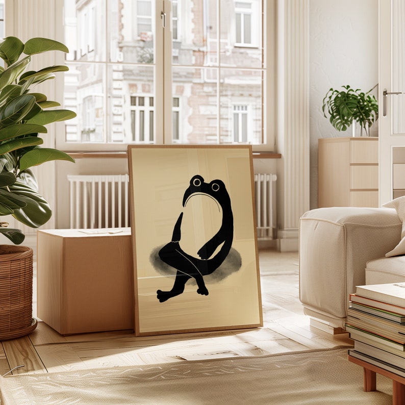 A close-up view of a Matsumoto Hoji Frog Print in a wooden frame, showcasing the intricate details of the frog’s silhouette and the artist’s skillful use of negative space, perfect for any art lover’s collection