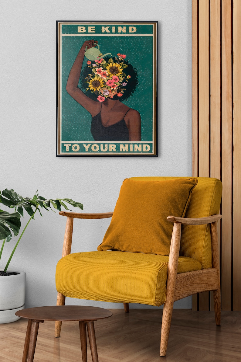 Framed poster with "Be Kind to Your Mind" text on a soothing yellow gradient background, complemented by cozy furniture and natural elements, emphasizing self-care and mental well-being.