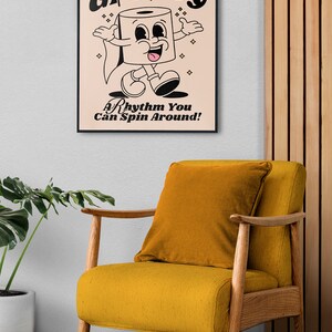 Vibrant living room scene featuring a framed poster with 'Groovy' cartoon character and a humorous toilet paper roll cartoon, set against a backdrop of a yellow chair and wooden decor elements.