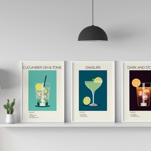 Three cocktail prints (Cucumber Gin & Tonic, Daiquiri, Dark and Stormy) displayed on a white shelf with minimalist décor, enhancing the stylish look of the space.