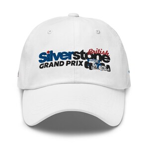 May include: White baseball cap with an embroidered logo that says "Silverstone British Grand Prix" with a red, white, and blue race car.