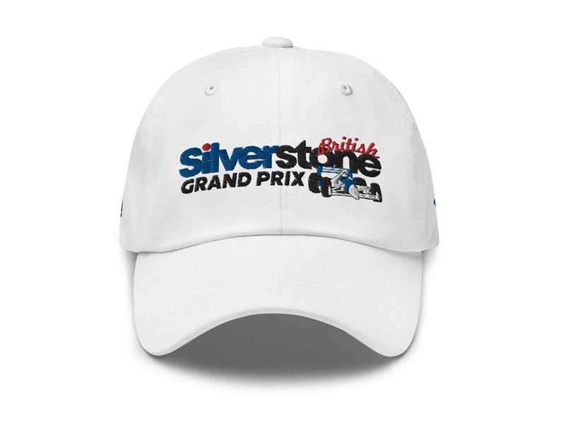 May include: White baseball cap with an embroidered logo that says "Silverstone British Grand Prix" with a red, white, and blue race car.