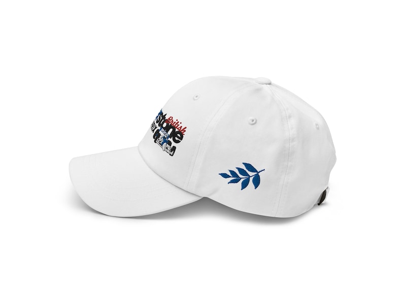 May include: White baseball cap with an embroidered logo that says "British Stone" and a blue leaf on the back.