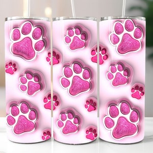 Op de afbeelding: Drie roze roestvrijstalen bekers met een roze glitter-pootafdruk ontwerp.