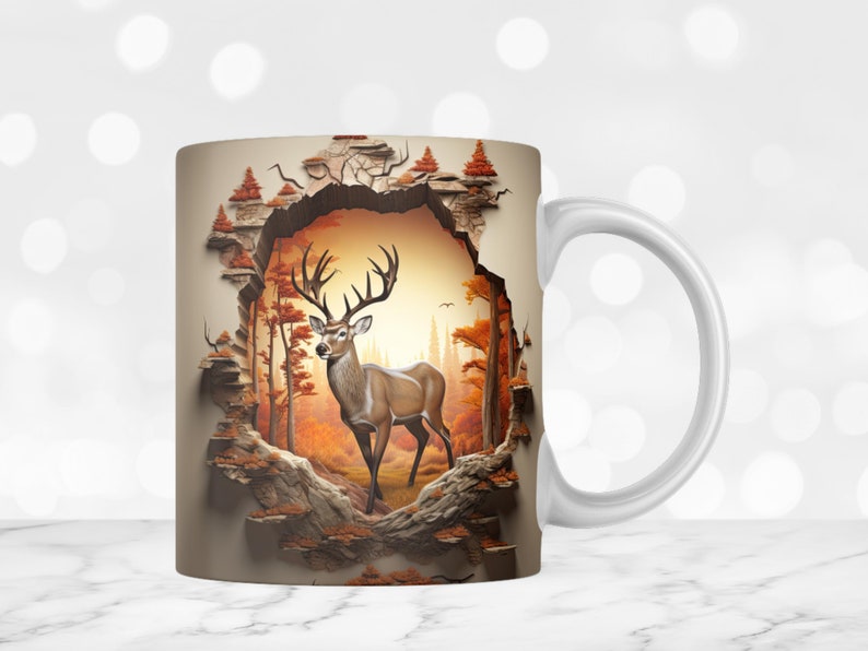 May include: White ceramic mug with a 3D design of a deer standing in a forest scene. The deer is brown with white markings and has large antlers. The forest scene is depicted in shades of brown, orange, and green.