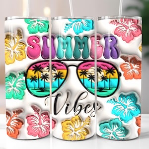 May include: Three stainless steel tumblers with a white background and colorful floral and palm tree designs. The tumblers feature the text "Summer Vibes" in a colorful, 3D font.
