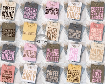 May include: A selection of t-shirts with coffee-related slogans in various colours, including white, pink, and grey. Each shirt features a different phrase, such as "Coffee Mode" and "Coffee Vibes", printed in bold, contrasting fonts. The shirts are displayed on denim.