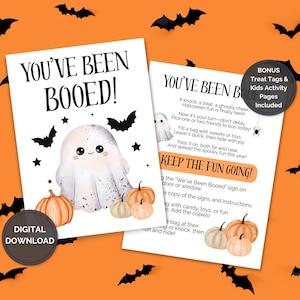 May include: Two Halloween-themed printable signs with the text "YOU'VE BEEN BOOED!" and instructions. The signs feature a cute ghost, pumpkins, bats, and stars on an orange background. Includes bonus treat tags and kids activity pages.