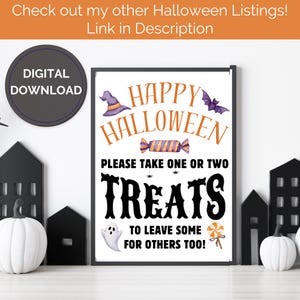 May include: A Halloween-themed framed print with orange and black text and illustrations. The sign says "Happy Halloween" and "Please take one or two treats to leave some for others too!" with a witch hat, bat, and candy.
