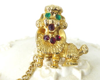 Sweet little emerald green eyed gold poodle tie tack with ruby red crystal necklace. Chain hardware. Dog lover gift, comes gift packaged