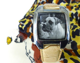 Unique upcycled watch featuring majestic Bullmastiff dog. Faux alligator band in cream with bold face frame in silver. Comes gift packaged