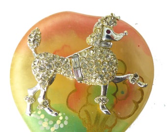 Silver and crystal elegant prancing poodle brooch with baguette collar harness and latch back,red crystal eyes. Gorgeous, Packaged as a gift