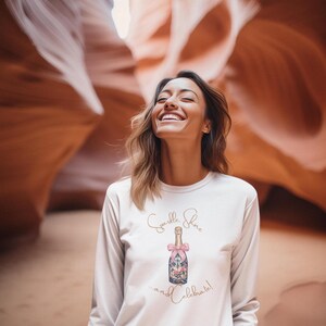 woman wearing holiday Sparkle Shine and Celebrate long sleeve t-shirt perfect for uplifting feel good shirt for women