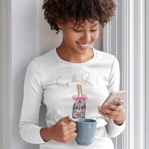 woman wearing holiday Sparkle Shine and Celebrate long sleeve t-shirt perfect bachelorette party shirts feel good shirt for women