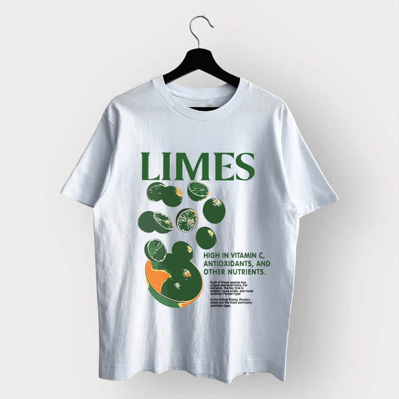May include: Light blue t-shirt with a green graphic of limes and the word "Limes" in green block letters. The shirt also has text that reads "High in Vitamin C, Antioxidants, and Other Nutrients."