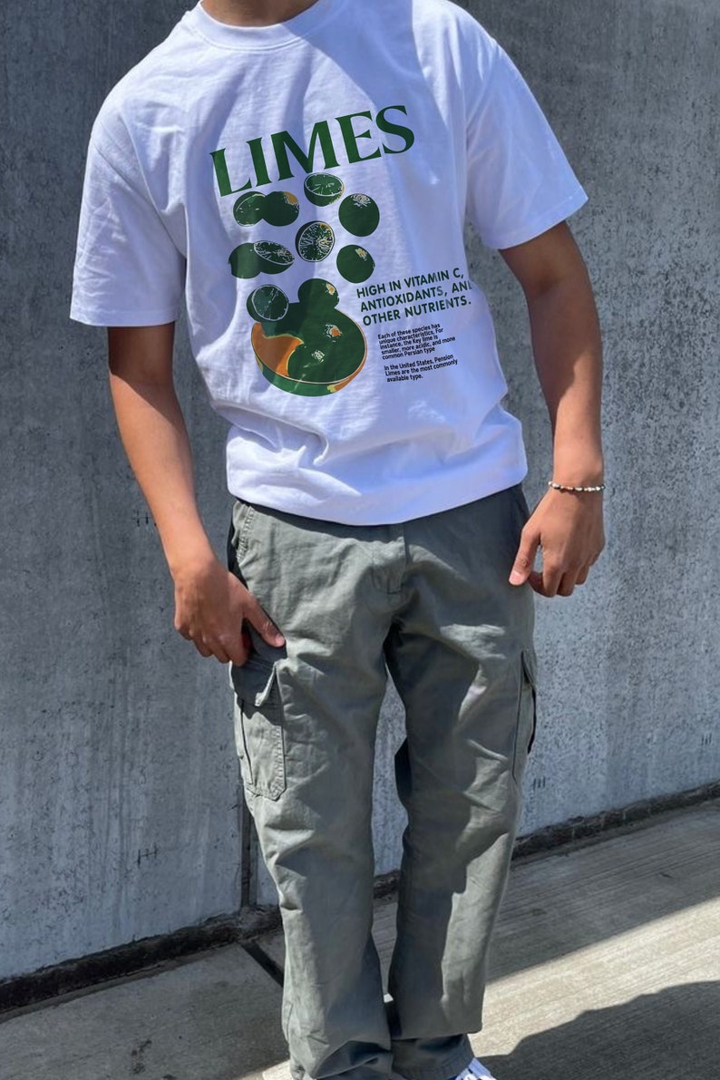 May include: White t-shirt with a green graphic of limes and text that reads "Limes" and "High in Vitamin C, Antioxidants, and Other Nutrients." The shirt is paired with olive green cargo pants.