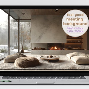 May include: A laptop screen displaying a cozy living room with a fireplace, large windows, and plush seating. The text "feel good meeting background" is displayed on the screen.