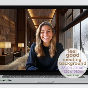 May include: A woman smiles at the camera while sitting in front of a laptop. The laptop screen shows a warm, inviting interior with wooden walls and large windows. The text on the screen reads "feel good meeting background 3840 x 2160px 1920 x 1080px warm & cozy".