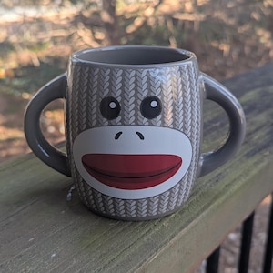 Galerie Sock Monkey Mug Two Handled Disability Friendly Coffee Mug with minor wear