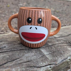 Galerie Sock Monkey Mug Two Handled Disability Friendly Coffee Mug with minor wear