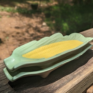 Corn Kid ceramic Corn on the Cob plates Set of 2 for Banana splits, hot dogs, and corn with minor wear and tear from prior use