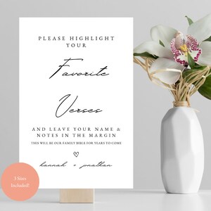 May include: White card with black text that reads "Please highlight your favorite verses and leave your name & notes in the margin. This will be our family bible for years to come."  The card also has a heart symbol and the names "Hannah + Jonathan" written in cursive.