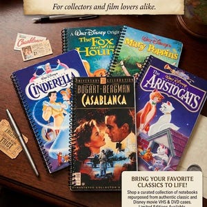 May include: A collection of spiral-bound notebooks featuring vintage film covers including The Fox and the Hound, Mary Poppins, Cinderella, Casablanca, and The Aristocats. The notebooks are displayed with two silver pens and small paper movie tickets.