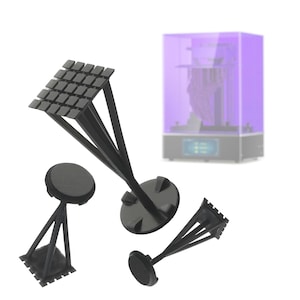 May include: Three black 3D printed resin supports for a 3D printer. The supports have a square base and three legs that converge at a point. The supports are designed to hold objects in place during the printing process.