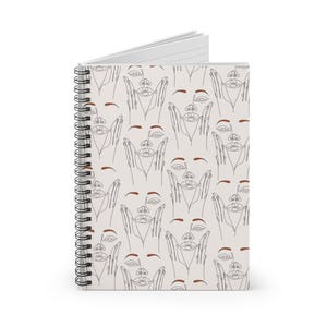 May include: A spiral-bound notebook with a cream-colored cover featuring a repeating line art pattern of faces with hands. The faces are drawn in a minimalist style with brown accents. The notebook has a black spiral binding and white pages.