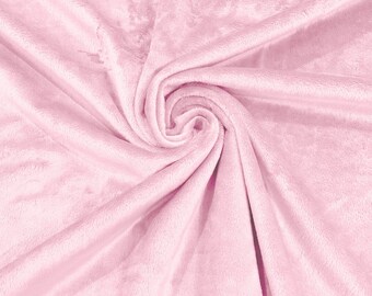 May include: A soft, pink plush fabric with a smooth, velvety texture. The fabric is folded and draped, creating a gentle, flowing effect.