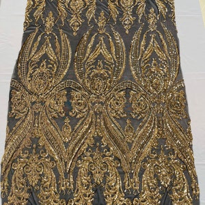 Gold Shiny sequin damask empire design on a Black 4 way stretch mesh fabric -sold by the yard.