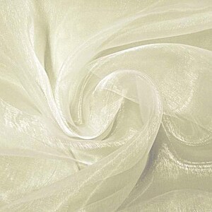 May include: A close-up of ivory white sheer fabric with a soft, flowing texture. The fabric is translucent and has a subtle shimmer.