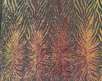 Aqua clear iridescent phoenix feather design with sequins embroider on a White 4 way stretch mesh fabric-sold by the yard. main image 0