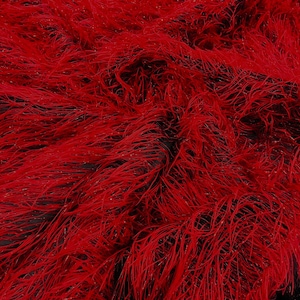 May include: Red and black feather trim fabric. The fabric has a soft, fluffy texture.