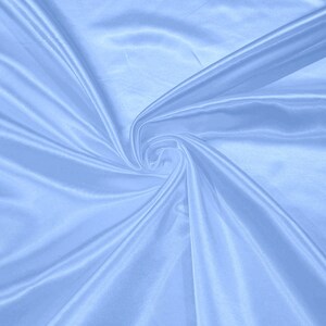 May include: A smooth, light blue satin fabric with soft folds and wrinkles.