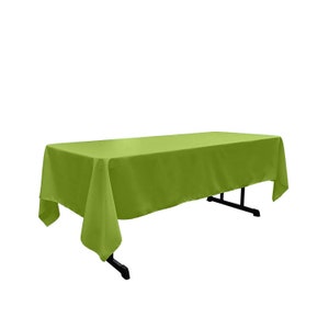 May include: A solid green rectangular tablecloth draped over a table. The tablecloth is made of a smooth, wrinkle-resistant fabric.