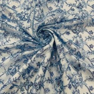 Light Blue Metallic - Corded Lace/Small Butterfly Design Embroidered With Sequin on a Mesh Lace Fabric.
