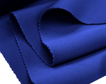 May include: A close-up of a folded piece of royal blue fabric. The fabric has a smooth, even texture.