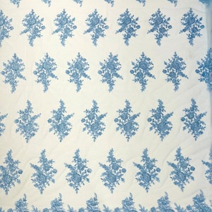 Floral corded embroider with sequins on a mesh lace fabric-prom-sold by the yard. LIGHT BLUE.