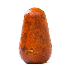 May include: A single, teardrop-shaped object with a textured, orange-brown surface. The object has dark spots and a slightly rounded top, tapering to a narrower base. The background is plain white.