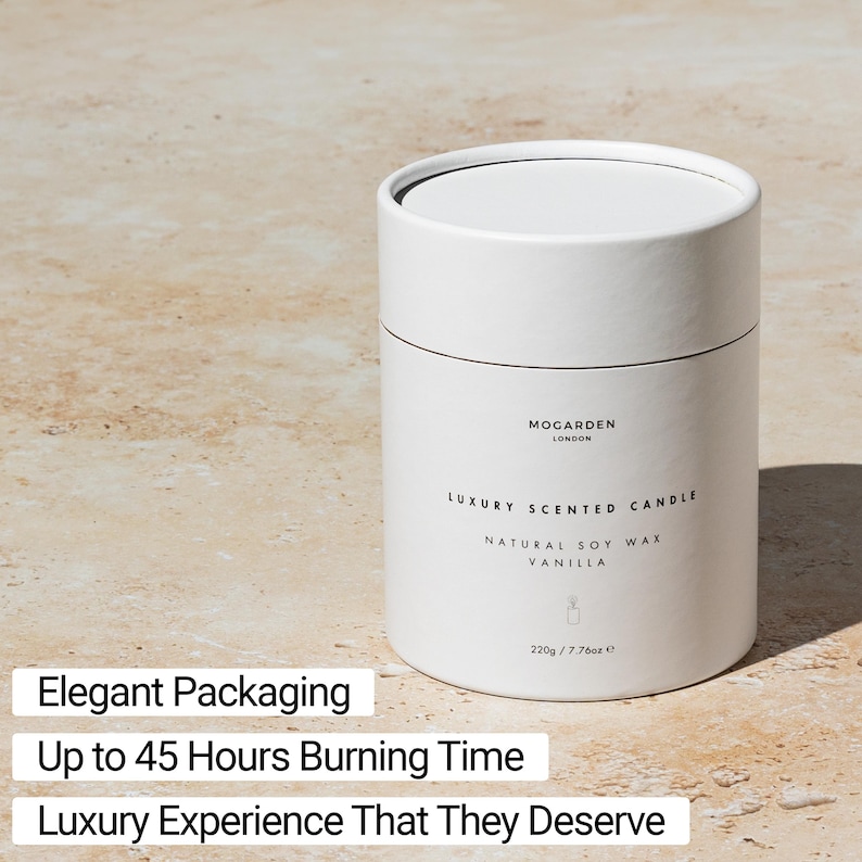 May include: A white cylindrical candle container with a black lid. The label reads "MOGARDEN LONDON LUXURY SCENTED CANDLE NATURAL SOY WAX VANILLA" and "220g / 7.76oz". The text "Elegant Packaging", "Up to 45 Hours Burning Time", and "Luxury Experience That They Deserve" are also visible.